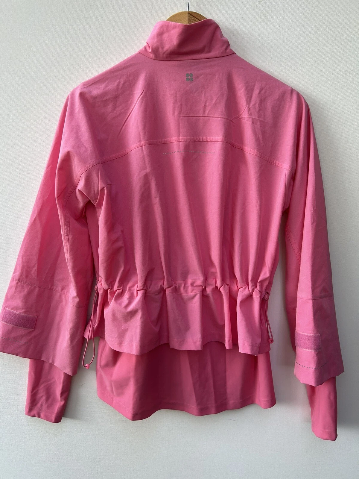 sweaty-betty fast lane windbreaker ruffled zip front workout jacket