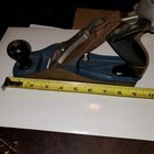 Vintage blackhawk C557MP wood hand plane with worn silver handle, yellow tape measure, and visible “Made in U.S.A.” text.