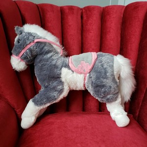 large stuffed horse with saddle