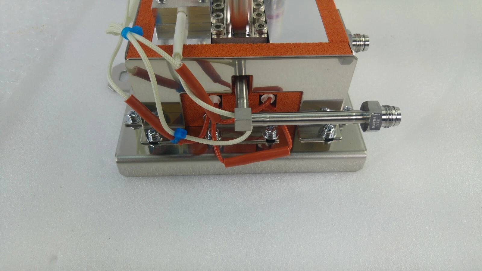 End of the gas box with tube stub fitting and thermocouple wiring