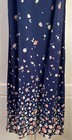 Navy blue midi dress with small white floral print, pink edges, and “E.D. Michaels” label on inner collar.