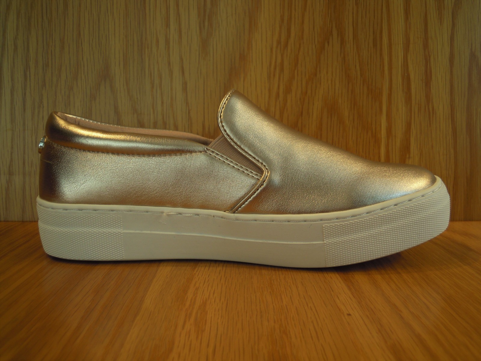 gold flatform trainers