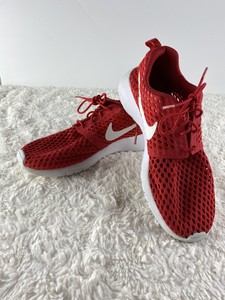 white nikes with red check