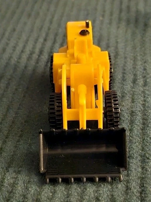 Excavadora de plástico vehículo cargador frontal amarillo 1:64 Foto 2 de 4