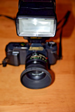 Canon camera T50 + Canon lens 50 mm 1:1.8 + Canon flash 299T