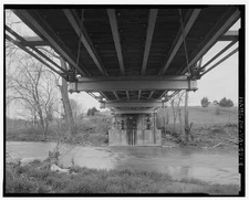 9. DETAIL VIEW STRINGER BEAM SYSTEM, UNDERNEATH, LOOKING WEST - Linville Creek