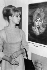 Mandy Rice-Davies stands next to a portrait of herself at an exhib- 4x6 Photo