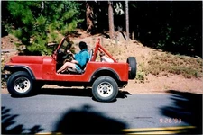 Man And Boy Driving Red Jeep In The Forest Found Photo V2195