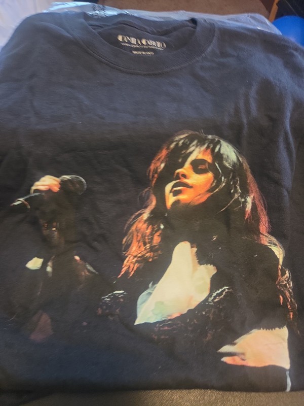 This is a black Camila Cabello Never Be the Same Tour graphic t-shirt.