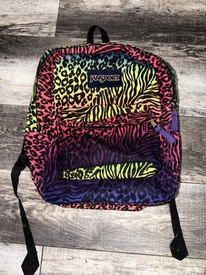Vintage JanSport backpack in vibrant multicolor animal print.