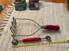 Lot of 2 … Vintage red farmhouse masher & double melon baller Utensil