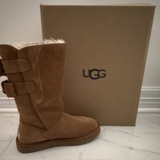 UGG brown suede mid-calf winter boots. Shearling lined, bow accent, pull-on