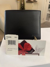 Coach black leather bi-fold wallet with an ID window
