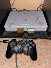 Playstation 1 console with controller, cables, &Metal Gear Solid Greatest Hits