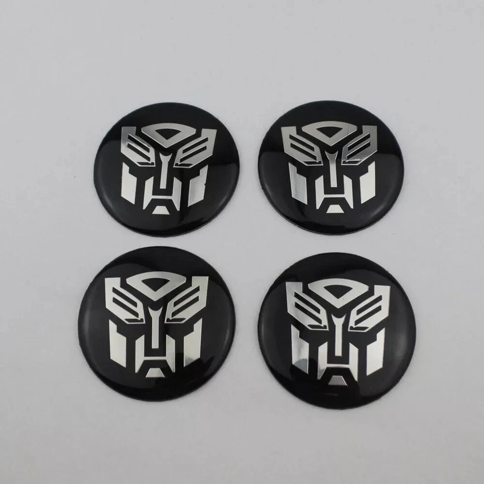 4 Piezas Transformers Autobots Calcomanía Cúpula Metal Rueda Centro Pegatina 2.2" Foto 2 de 2