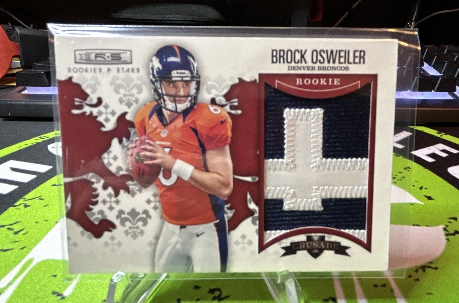 Brock Osweiler Panini Rookies & Stars Rookie Crusade #24 Material-Red