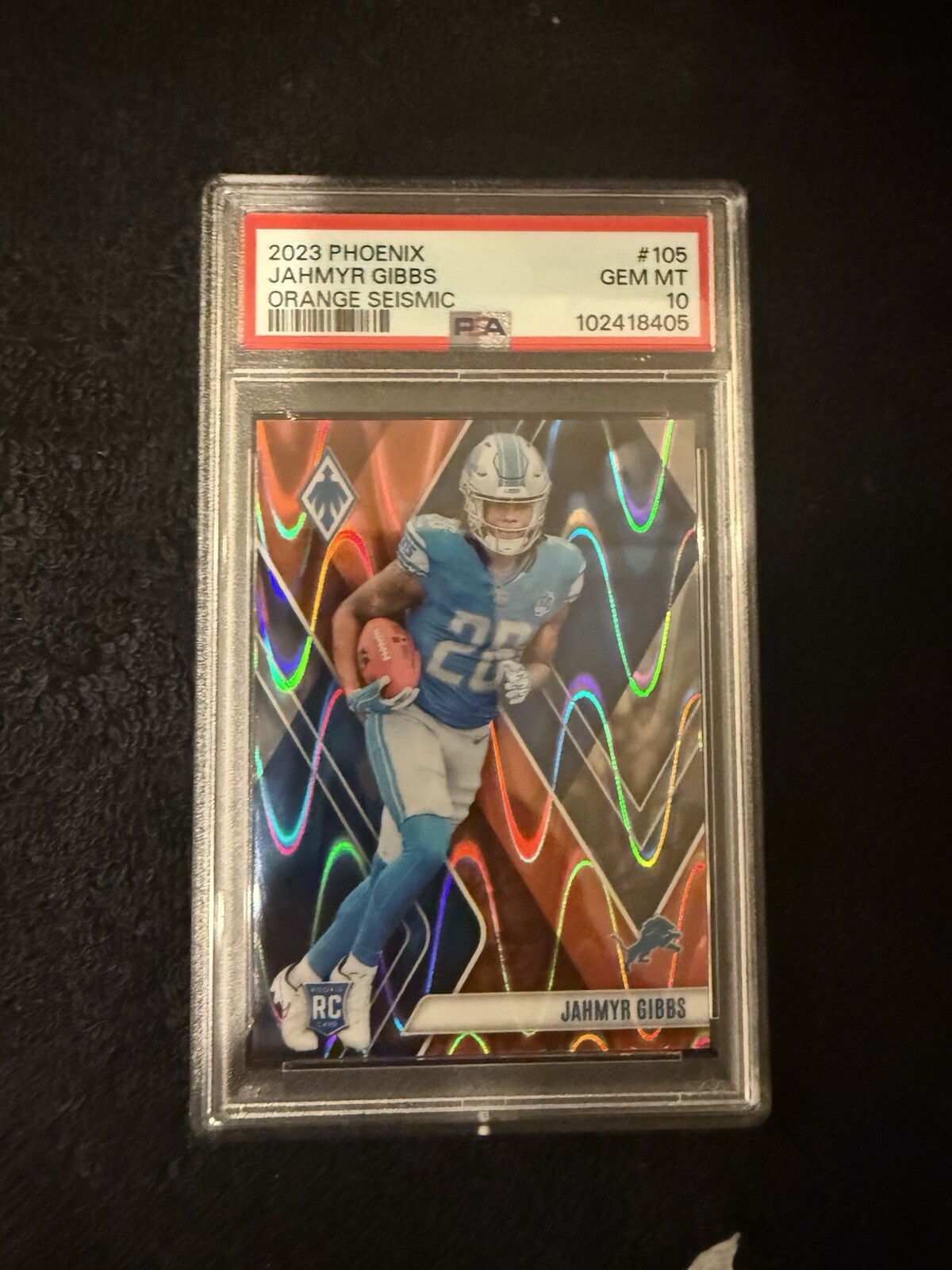 JAHMYR GIBBS 2023 Panini Phoenix #105 Orange Seismic /99 PSA 10 RC