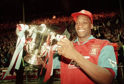 Aston Villa defender Ugo Ehiogu holding the trophy after their vic- Old Photo
