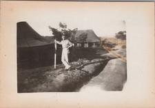 WW2 Photo of Soldier Leaning on Post by Canvas Tent and Trench Camp