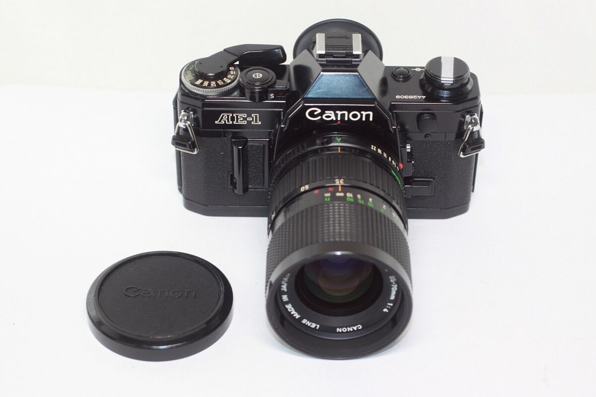 Canon AE-1 35mm SLR Film Camera + New FD 35-70mm F/4 Zoom Canon AE-1 35mm SLR Film Camera + New FD 35-70mm F/4 Zoom