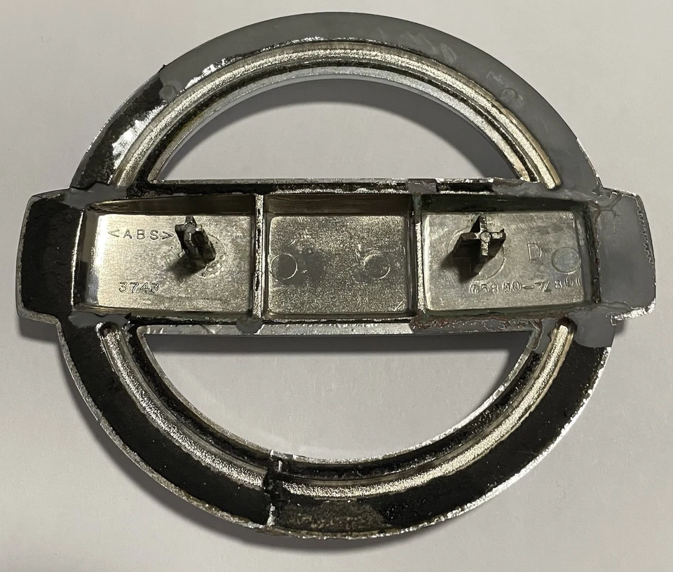 2001-2004 Nissan Xterra Front Emblem OEM  - Image 3 of 4