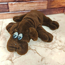 brown small pound puppy, missing nose