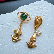 Orecchini Schiaparelli occhio di diavolo e labbra naso tono oro NUOVI