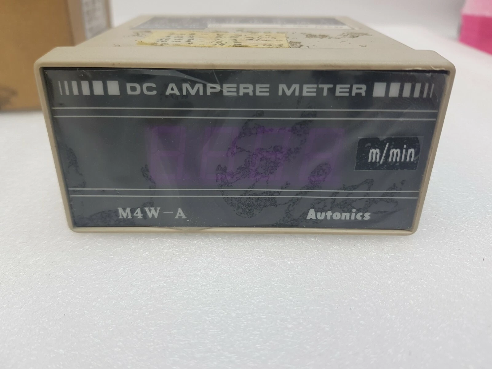 Front of the Autonics M4W-A DC ampere meter with m/min unit label on the window