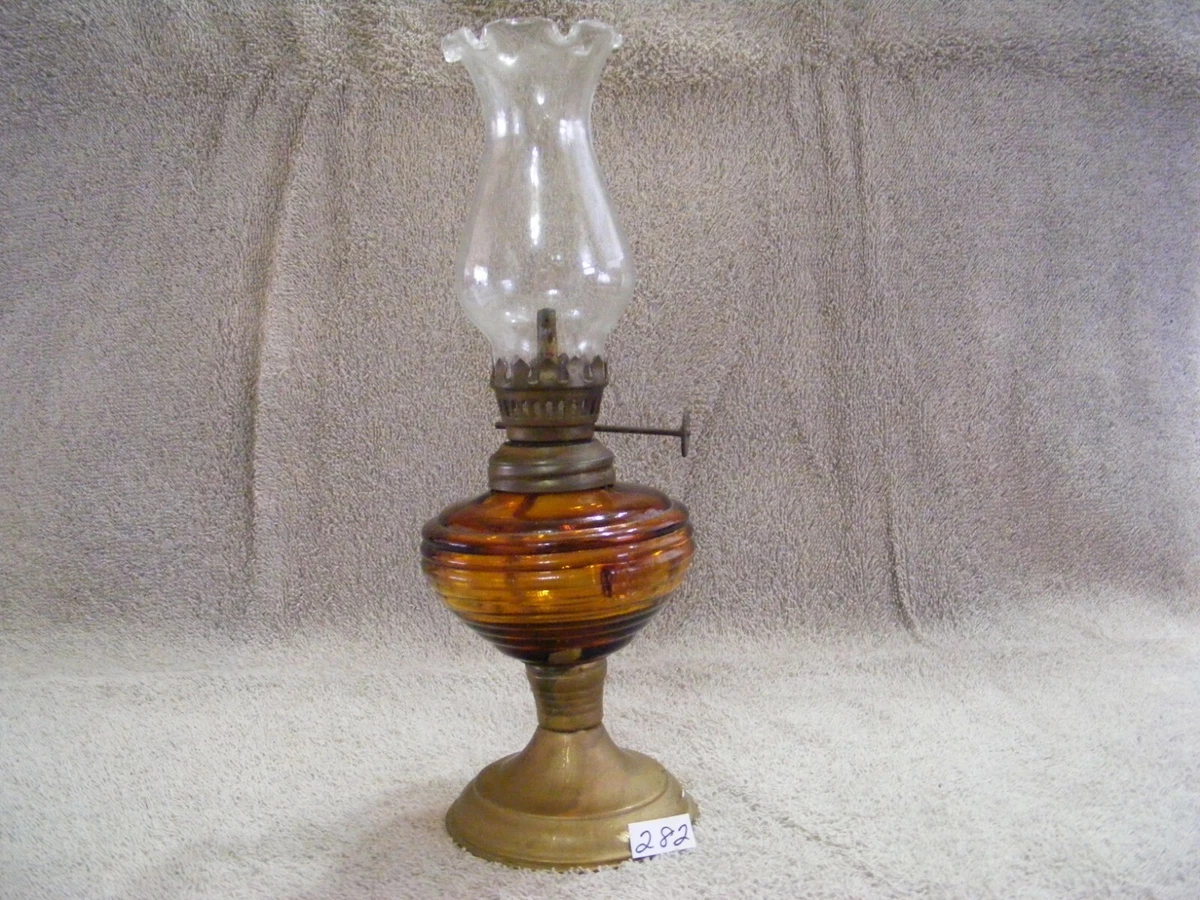 282 MINATURE GOLD GLASS OIL LAMP WITH GOLD COLOR METAL BASE AND CLEAR GLOBE