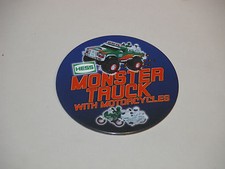 HESS 2007 MONSTER TRUCK WITH MOTORCYCLES CASHIER BUTTON MINT