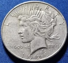 A 1926-D Peace Dollar 90% Silver $1 Dollar.  Nice High Grade