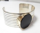STERLING SILVER AND 14K GOLD ONYX CUFF BRACELEY BY M & J SAVITT
