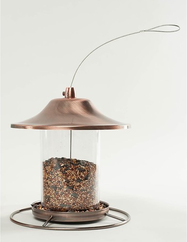 Copper-toned 53002 Farmer’s Delight wild bird food dispenser with clear plastic lens and long wire hanging loop.