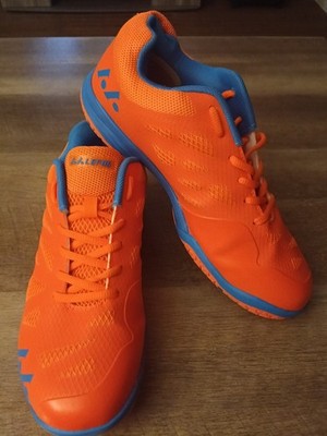 This is a BRAND NEW pair of orange and blue Lefus unisex indoor court shoes.