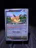 Pokemon Prismatic Evolutions - Eevee Pokeball Reverse Holo 074/131