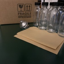 8 Pack, 2 oz Small Clear Glass Bottles w/ Lid  2 Stainless Steel Funnels - 60ml