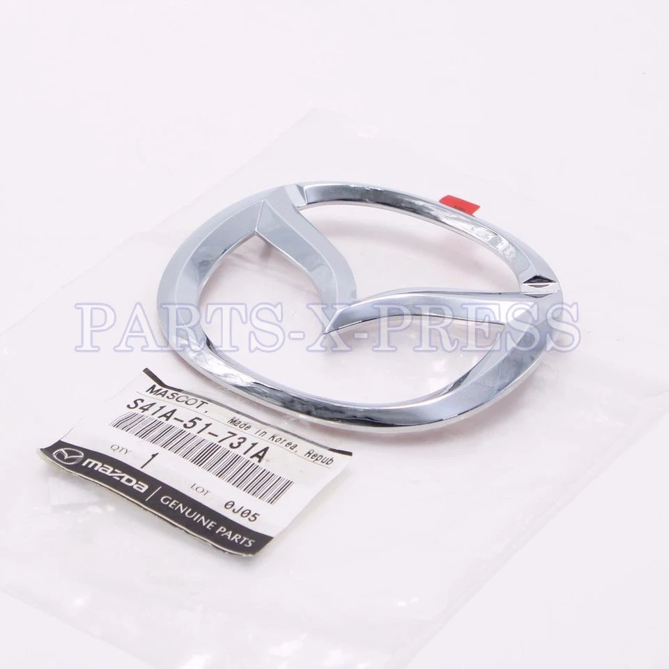 REJILLA DELANTERA CROMADA EMBLEMA PROTEGIDO ORIGINAL MAZDA MILLENNIA MONTADA S41A-51-731A Foto 2 de 4