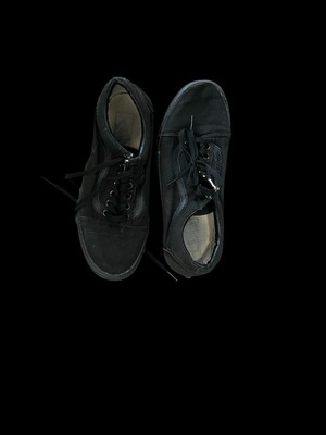   Black Vans trainers 