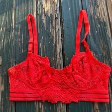 Red lace bralette with adjustable straps and removable pads. Size: 32B
