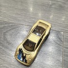 Hot Wheels Jaguar XJ220 * Color: Dorado metálico con gráficos azules y negros — photo 5