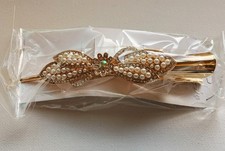 Gold and White Hair Clip. Brand-New Condition, In Orginal Packaging