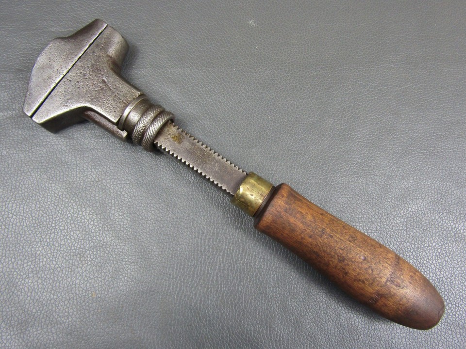 An 11" early buggy wrench with adjustable jaws — a pre-automotive era tool with a gorgeous patina and the kind of mechanical elegance that predates modern manufacturing.