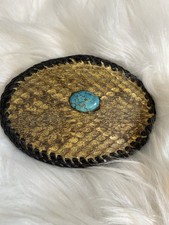 western-style leather belt buckle with a turquoise stone and rattlesnake skin