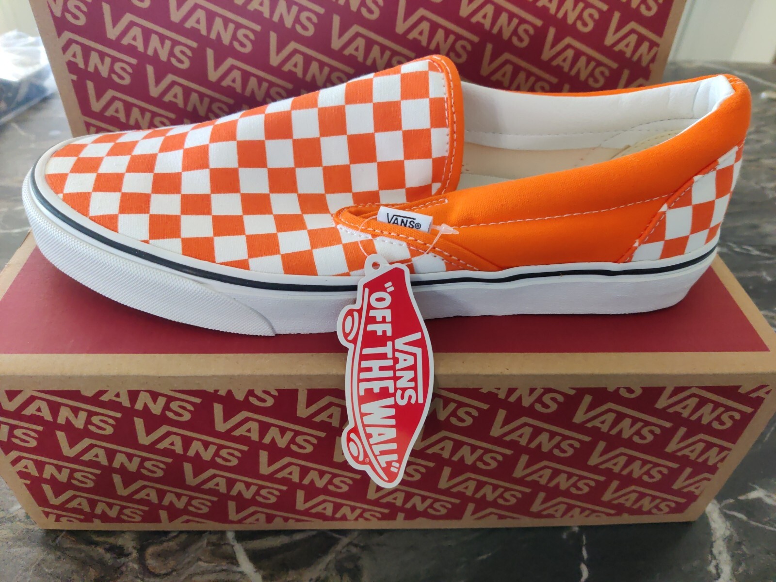 white and orange checkered vans