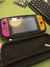 Nintendo Switch Console, Purple and orange joycon comes with case (Console Only)