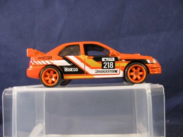 Subaru Impreza 2025 Orange Hot Wheels ligeramente pintado, con cambio de rueda de pilotos reales Foto 4 de 4