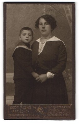 Photograph Rudolf Hahn, Berlin, mother in dark dress with her son in matro 