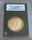1964-P Kennedy 50c Silver MS68 Full Strike Coin with Rainbow Tone.