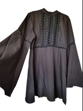 Elegant Black Dress with Unique Details