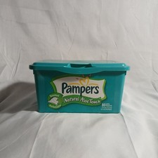 Vintage empty Pampers baby wipes container.